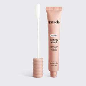 KITSCH Performance Ritual Kit — Styling Taming Wand hero shot of the pink tube beside its silicone spoolie applicator — your post-workout fix for flyaways, frizz, and baby hairs