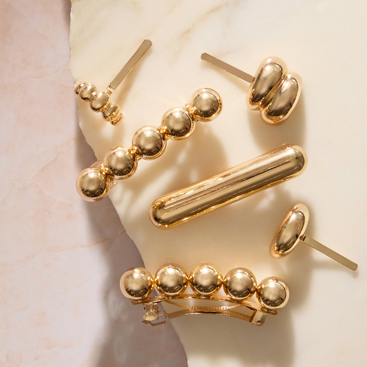 Barrette in metallo dorato