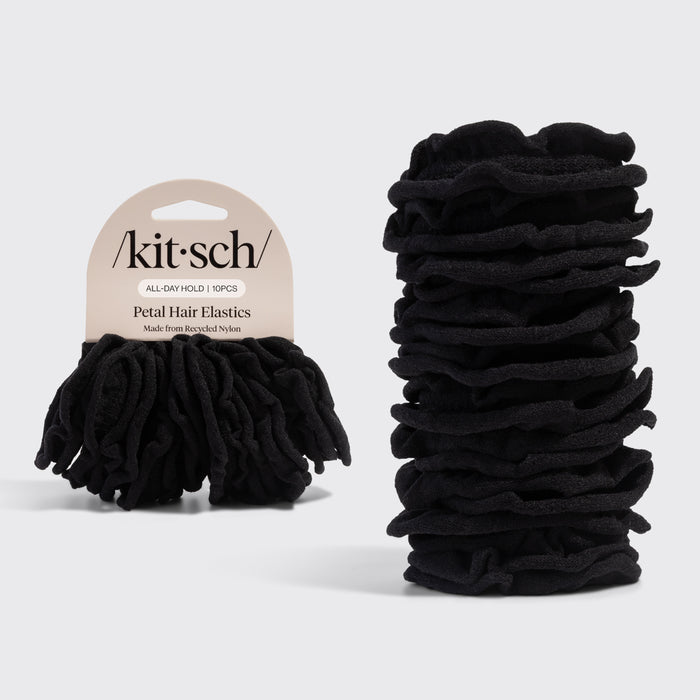 Black petal hair elastics with 'Kitsch' packaging on a light gray background