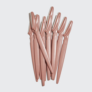 Kitsch Touch Up Dermaplaners 12pc in Terracotta with twelve blades fanned out on a light studio background