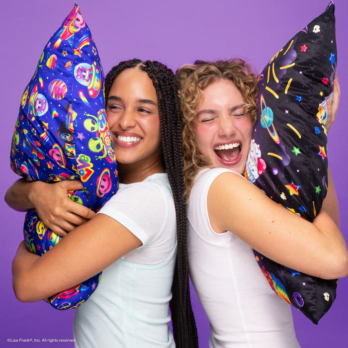 Two friends hugging Lisa Frank x Kitsch satin pillowcases